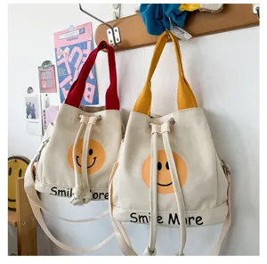 Lässige Canvas Eimer Tasche mit süßem Smiley Gesicht Druck, modische Umhängetasche für Damen.