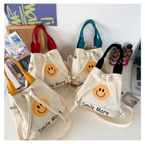 Leinwand Eimer Tasche mit süßem Smiley Gesicht Druck und bunten Griffen für den Alltag.