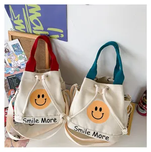Schöne Damen Canvas Eimer Tasche mit Smiley Print, lässige Handtasche mit Schultergurt.