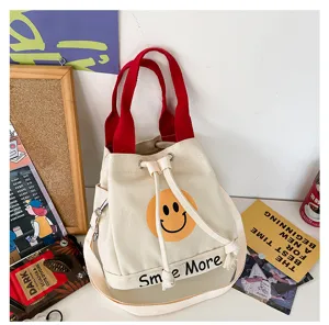 Canvas Eimertasche für Damen, süßes Smiley-Muster, modische Umhängetasche und Handtasche.