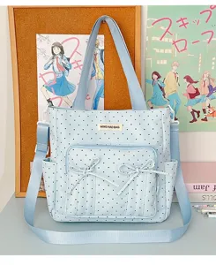 Lindo bolso de mano azul con lunares y lazos, bolso cruzado versátil para uso diario.