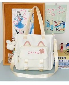 Niedliche Segeltuchtasche mit Katzenohren, gesticktem Gesicht und Umhängegurt Detail.
