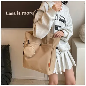 Large capacity canvas tote bag with coin purse, stylish shoulder bag for women daily commute.