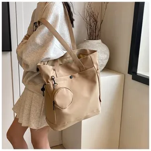 Spacious beige tote bag for women, large capacity shoulder bag with coin pouch for daily use.