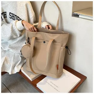 Large capacity beige canvas tote bag with front pocket and cute coin purse, detailed view.