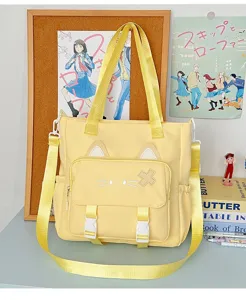 Gelbe süße Katzenohr Segeltuch Umhängetasche Detail, lässige Schülertasche mit schönem Gesicht.