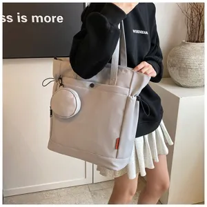 Detailed view of large capacity gray tote bag with coin pouch, stylish daily shoulder bag.