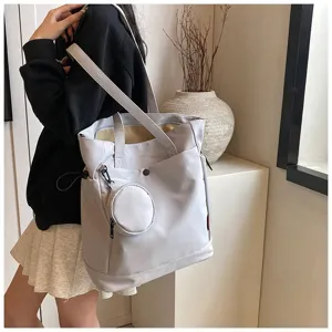 Minimalist grey large-capacity tote bag with coin purse, casual shoulder and handbag style.