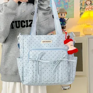Bolso tote de lunares azul claro con lazos bonitos y gran capacidad para el uso diario.