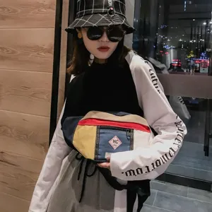 Streetwear farbblockierte Brusttasche Detail mit mehrfarbigem Canvas Patchwork und Reißverschluss.