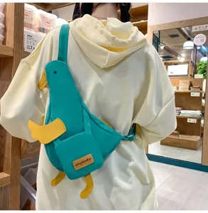 Niedliche Enten-Segeltuch-Umhängetasche, witzige Sling-Tasche für Damen, grüne Freizeittasche.