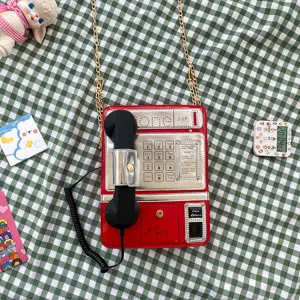 Kreative Retro Telefon Umhängetasche für Damen, rote Handtasche mit Kette und Hörer.