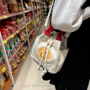 Segeltuch Eimer Tasche für Damen mit gelben Smiley Print, lässige koreanische Handtasche.