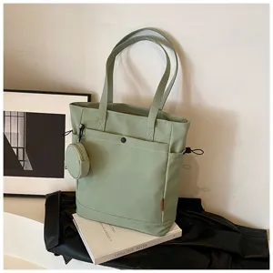 Green canvas tote bag with coin purse, large capacity shoulder bag for daily commuting.