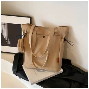 Beige canvas tote shoulder bag for women, large capacity handbag with coin pouch and handles.