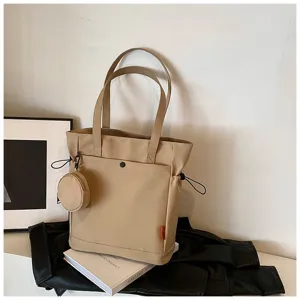 Large capacity beige canvas tote bag with shoulder straps, front pocket and coin purse.