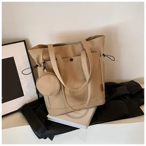 Beige canvas tote bag with coin pouch, large capacity casual shoulder bag for daily use.