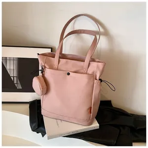 Stylish pink canvas tote bag with large capacity, shoulder straps and cute coin purse.