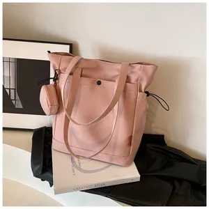Large capacity pink tote bag with shoulder straps, front pocket, and cute coin pouch.