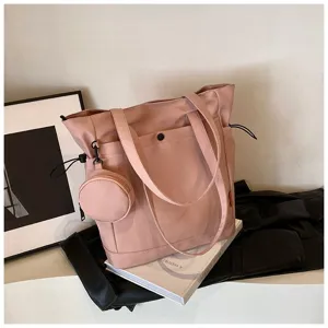 Detailed view of pink large capacity tote bag with coin purse, casual shoulder handbag design.