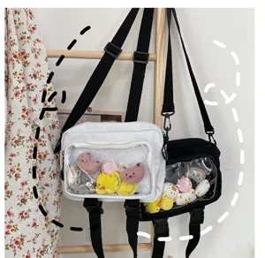 Transparent window canvas crossbody bag with cute plush toys, versatile casual shoulder bag.