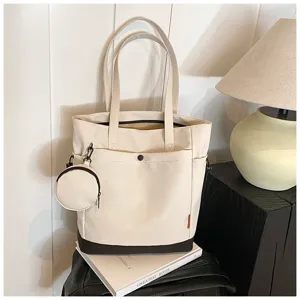 Large capacity canvas tote bag with coin purse, stylish shoulder handbag for daily travel.