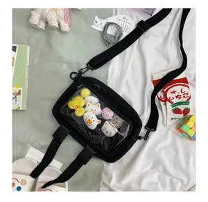 Korean style black canvas transparent window shoulder bag with cute plush toys inside for daily use.