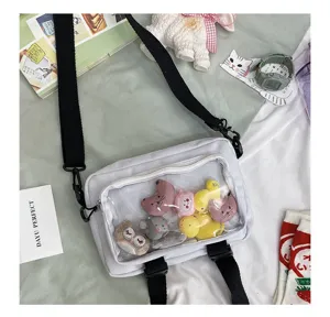 Korean style white canvas transparent crossbody bag with cute cartoon dolls for women.