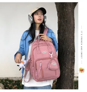 Mochila casual de lona estilo japones rosa para mujer gran capacidad bolsa escolar.