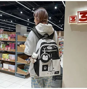Korean style polka dot backpack for women students, cute cartoon school bag with large capacity.