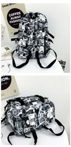 Trendy black and white graffiti backpack with newspaper letters and multiple straps for men.