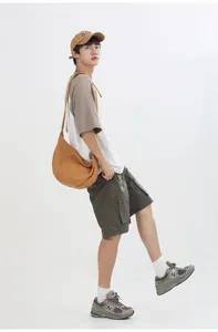 Bolso cruzado de lona de color sólido versátil para hombres y mujeres, diseño casual de moda.