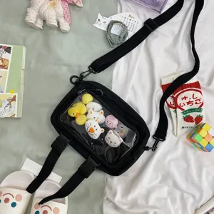 Black canvas crossbody bag with clear window and cute plush toys for women daily casual use.