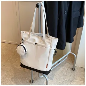 Large capacity canvas tote bag with coin pouch, stylish shoulder bag for women.