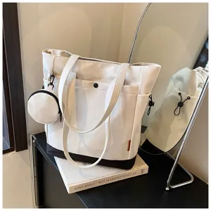 Detailed view of the black and white canvas tote bag featuring a cute matching coin pouch.