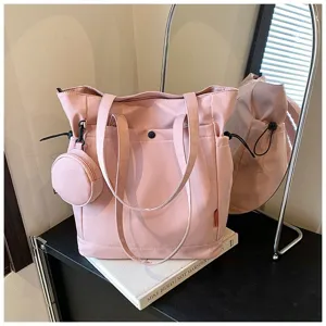 Detailed showcase of pink large capacity tote bag featuring sturdy handles and mini coin purse.
