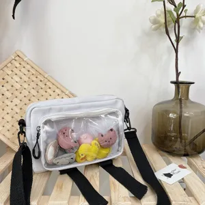 Clear window canvas crossbody bag detail view with cute plush toys inside for daily style.
