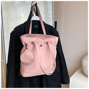 Large capacity pink tote bag with small coin pouch, stylish shoulder handbag for women.