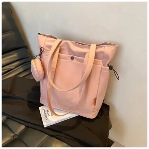 Stylish pink canvas tote bag with large capacity, shoulder handles and cute coin pouch.