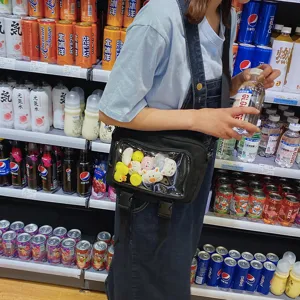 Black transparent crossbody bag with cute doll charms, stylish ins style shoulder bag for women
