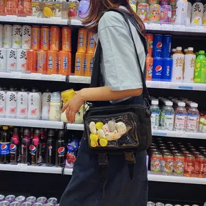Stylish transparent pocket crossbody bag with cute plush toys, perfect for casual daily wear.