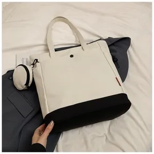 Large capacity colorblock canvas tote bag with small coin pouch and shoulder strap detail.