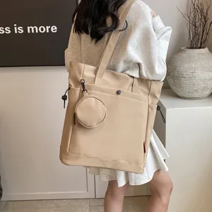 Large capacity beige tote bag with cute round coin pouch, stylish shoulder bag for women.