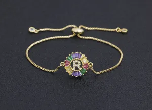 Gold plated colorful zircon letter R pendant bracelet detail close up, adjustable link chain.