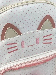 Primo piano dettagliato del simpatico zaino gatto a pois rosa con dettagli di baffi ricamati.