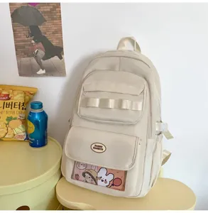 Zaino scolastico casual in tela beige stile ins con finestra trasparente e molte tasche.