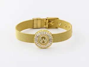 Close-up detail of gold plated mesh bracelet with circular zirconia letter W pendant.