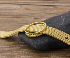 Detail view of 18k gold plated brass mesh DIY bracelet strap accessory, fine texture.