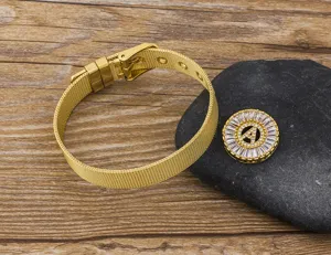Gold plated mesh bracelet detail view featuring micro paved zircon letter A charm on stone.