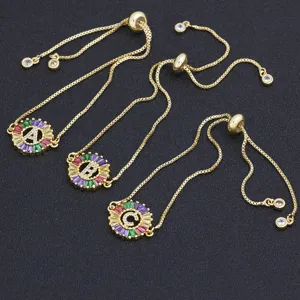 Gold plated colorful alphabet slider bracelet with round cubic zirconia pendant for women.